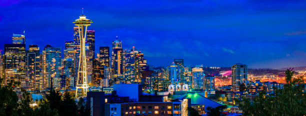 Seattle, USA - March 16, 2013: Reflection of the Space Needle on the colorful sheet metal exterior of the Experience Music Project Museum.