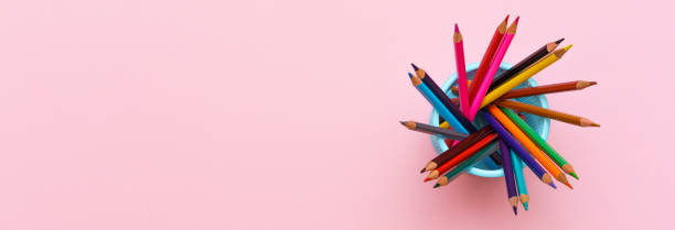 istock Colored wooden pencils on pink background, education concept. 1406863867