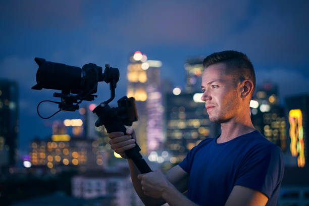 Portrait of videographer with camera and gimbal