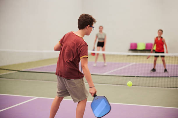 istock A boy hits a ball in a pickleball match. 1406865796