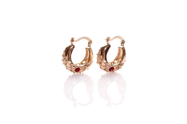 istock Gold earrings with red gem. Isolated 1406866527