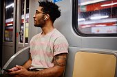 Solo traveler using subway train to get around the city