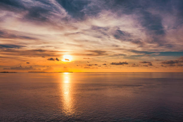 istock Aerial view of sunset over ocean in Maldives 1406868942