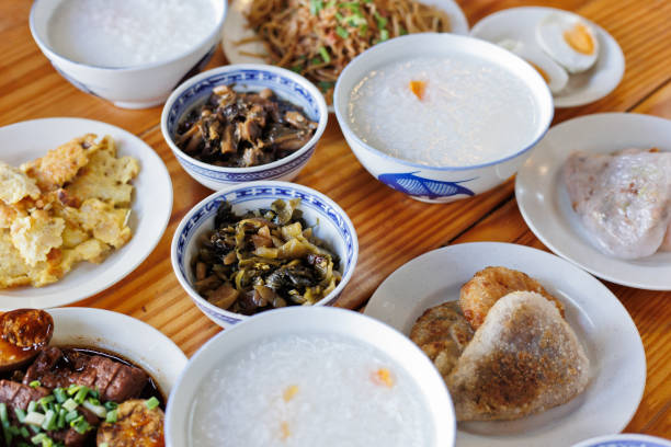 istock Chinese style rice porridge with various side dishes 1406868963