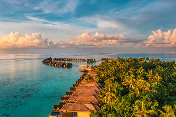 aerial view of luxury resort in maldives - lagoon tranquil scene sea water imagens e fotografias de stock