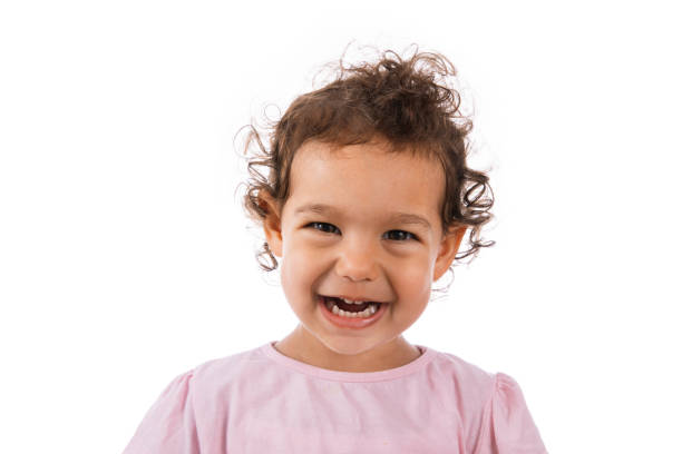 A cute girl with a vestibular hard mouth guard plate for correcting the bite of teeth in orthodontics. bruxism. Children's orthodontic mouthguard. myofunctional trainer. mouth breathing habit.