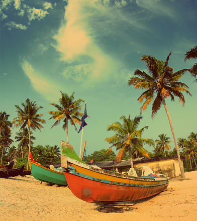 old fishing boats on indian beach - vintage retro style