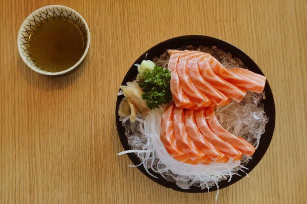 istock Close up slice of salmon sashimi 1406873710