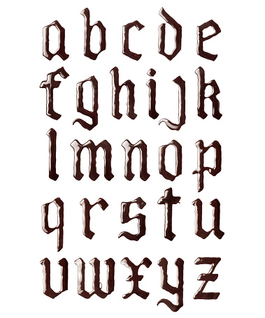 Glossy letters of the gothic font made of melted chocolate