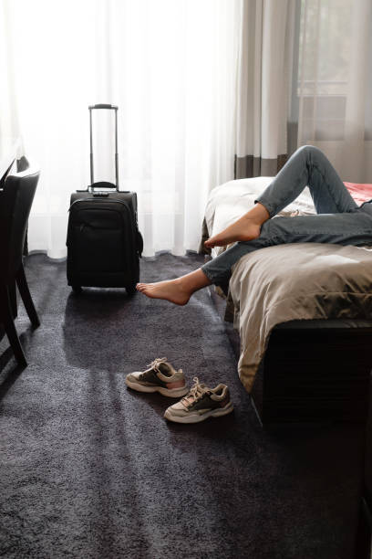 istock Female being tired after a long journey resting in hotel suite. 1406874800
