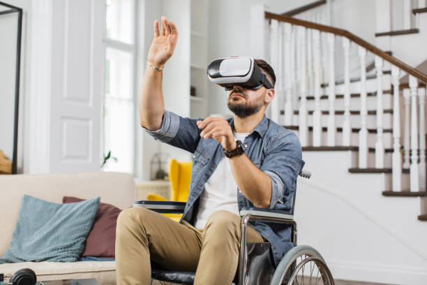 istock Man with special need playing virtual reality game indoor 1406879313