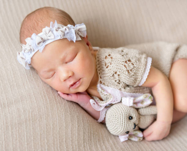 istock sleeping newborn baby girl 1406879832