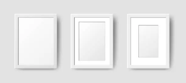 Vector illustration of Realistic Rectangle Empty Wall Photo Frames set. Vector vertical white picture frame mockup template with shadow on gray background. Mockup for poster, banner, photo gallery, painting, presentation