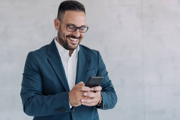 istock Businessman texting in the office. 1406880348