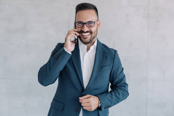 istock Businessman talking on the phone in the office. 1406880357