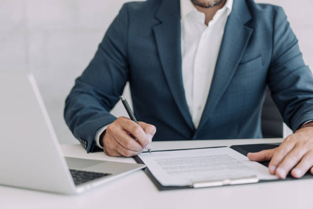 istock Businessman checking agreement before signing. 1406880361