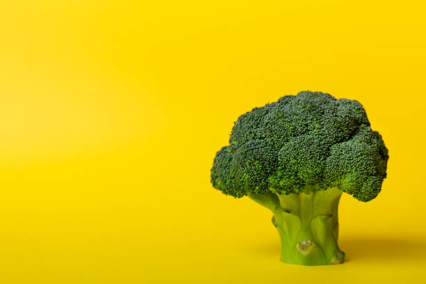 istock Top view fresh green broccoli vegetable on Colored background. Broccoli cabbage head Healthy or vegetarian food concept. Flat lay. Copy space 1406881246