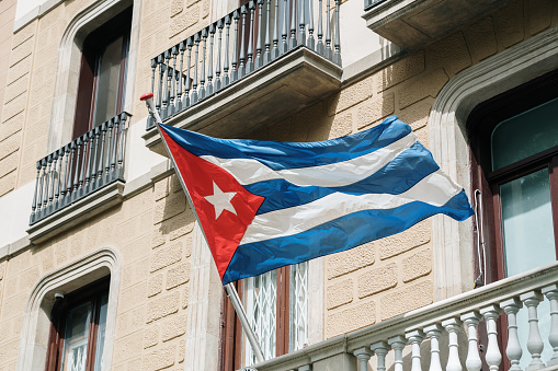 Large Cuban National Flag waving in the wind during the daytime