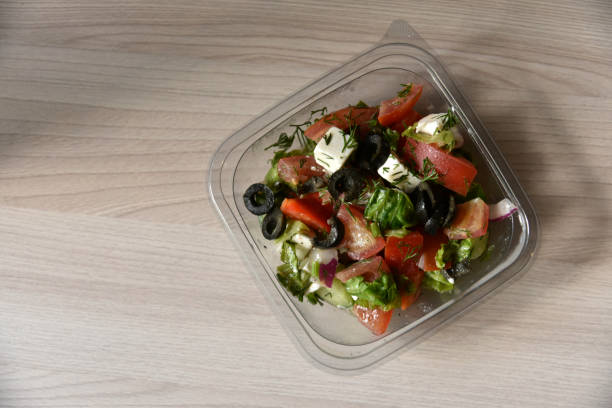istock Caesar salad with chicken and white suluguni cheese 1406882353