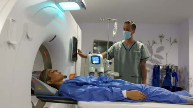 Latin American woman getting an MRI scan at the hospital