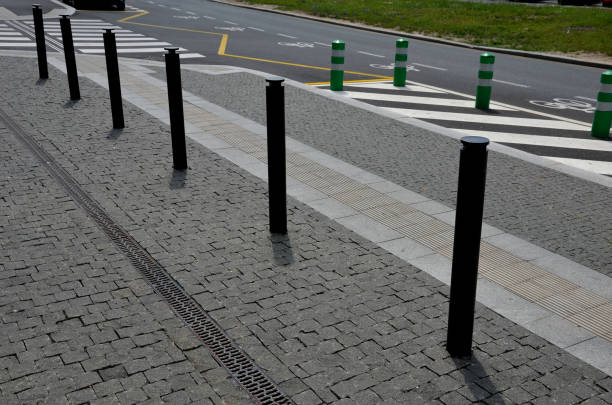 istock road signs drawn on the road side. zebra where he must not stop and park. asphalt with  support of green plastic posts. These posts are made of flexible rubber so they can beat,, paving. marble mosaic 1406884992