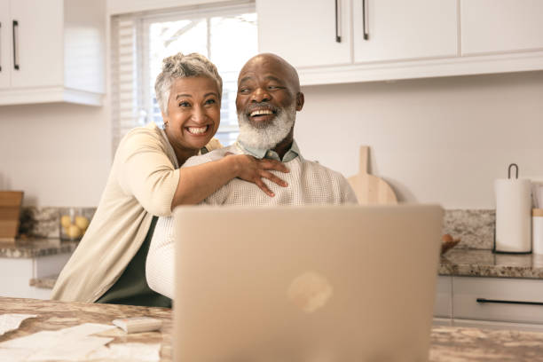 istock Cheerful couple going through their expenses 1406885151
