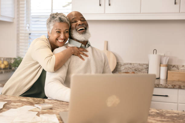 istock Cheerful couple going through their expenses 1406885163
