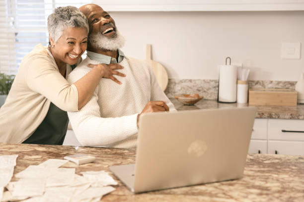 istock Cheerful couple going through their expenses 1406885172