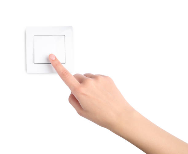istock Woman pressing light switch on white background, closeup 1406887357