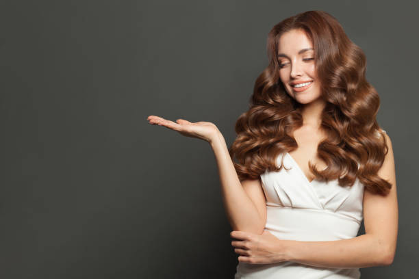 istock Beautiful young woman looking on hand 1406888099