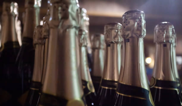 istock Bottles of sparkling wine with golden bottleneck 1406888107