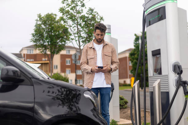 istock Waiting for Car To charge in Car Park 1406889658