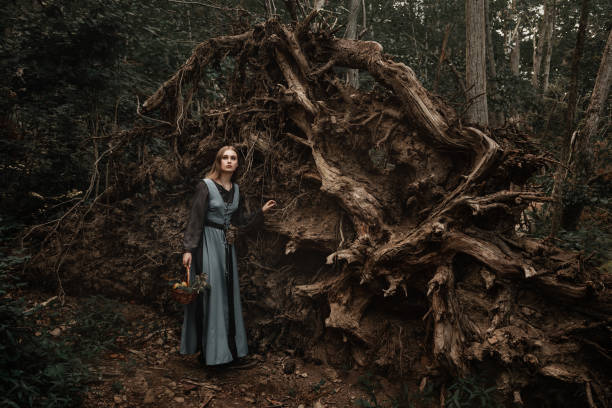 istock A mysterious witch walks in a dark forest 1406890042
