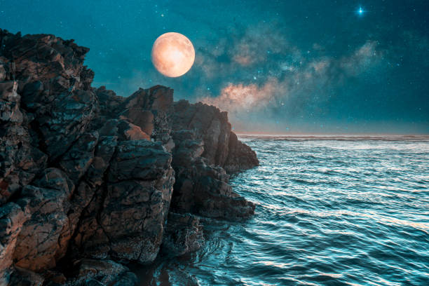 istock full moon over the cliff and ocean at night 1406892554