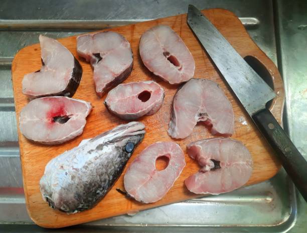 istock Cutting and slicing Snake head fish - food preparation. 1406893271