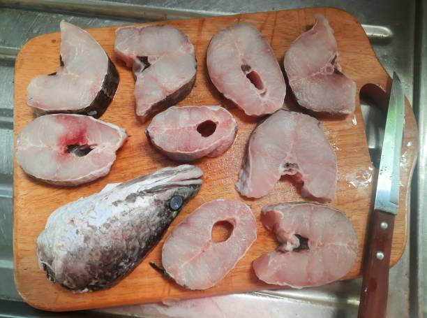 istock Cutting and slicing Snake head fish - food preparation. 1406893276
