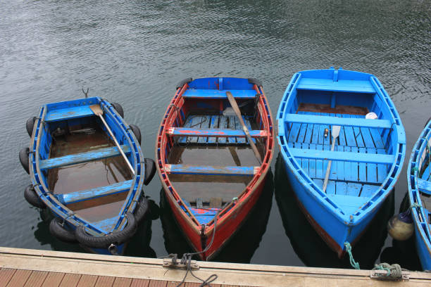 istock small weathered boats in Luarca 1406894823