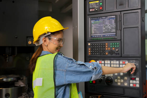 istock Blue collar worker with co worker at factory. 1406895014
