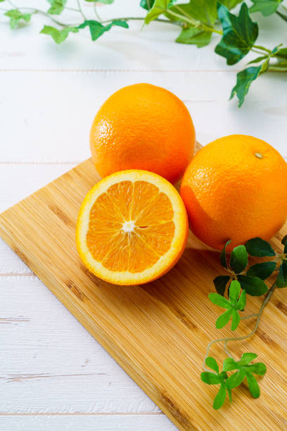 Fresh navel orange on wooden table Fresh navel orange on wooden table navel orange photos stock pictures, royalty-free photos & images