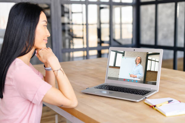 istock Young Asian woman studying online from home 1406898404
