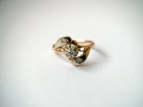 istock Gold diamond ring on a white isolated background. Red Gold Ring 1406898672