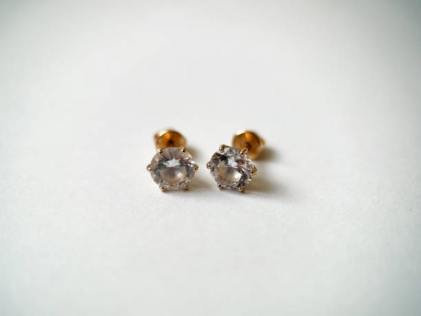 istock Gold stud earrings with cubic zirconia close-up 1406898680