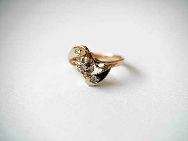 istock Gold diamond ring on a white isolated background. Red Gold Ring 1406898743