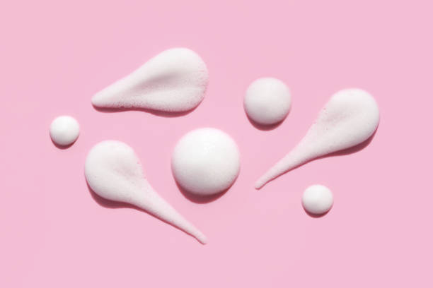 istock pattern texture foam mousse foam cosmetic smear sample on pink background 1406899925