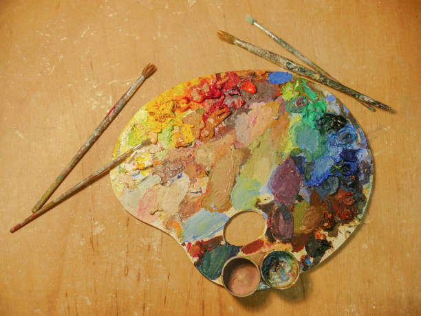 Colorful artist palette full of acrylic paint. close-up of art palette on background. Bright spots of oil paints. There is room for text. abstract oil painting for beginners stock pictures, royalty-free photos & images