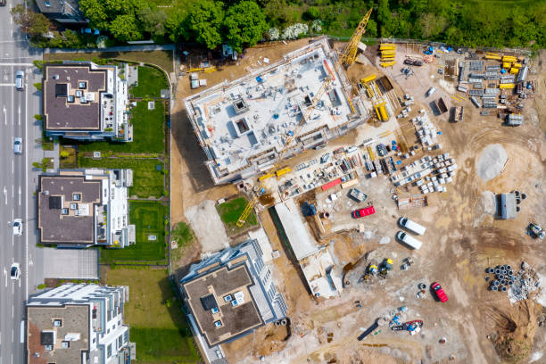 istock Large construction site, cranes and equipment - aerial view 1406903417