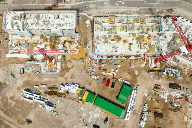 istock Large construction site, cranes and equipment - aerial view 1406903432