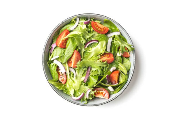 istock Summre green salad in white bowl plate on grey table 1406903611