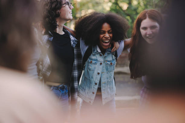 istock Cheerful teenage students standing together in a circle 1406904779