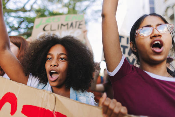 istock Vibrant teenagers marching against climate change 1406904906